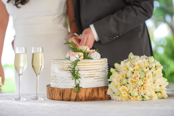beautiful wedding cake cutting on a wooden plate