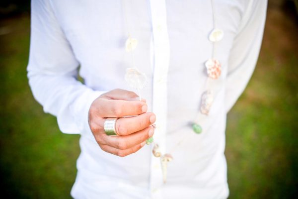 close up shot of wedding ring on groom