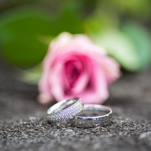Awesome ring on rock with rose flower in background