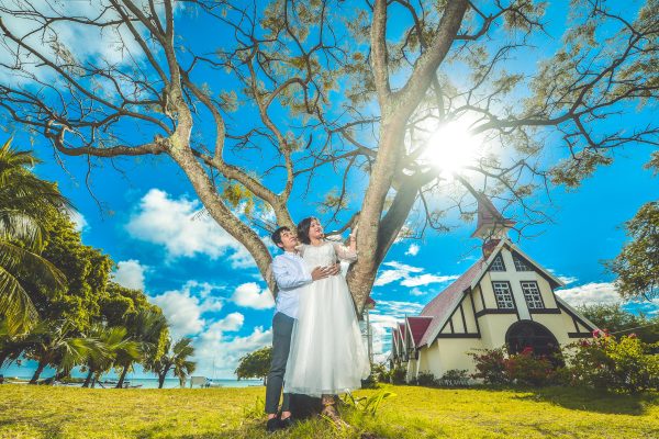 couple posing in front of church in Mauritius
